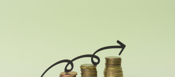 Graphic with the words ‘Earn More, Spend Less’ above a simple profit chart, illustrating how small businesses can increase revenue, reduce expenses, and grow overall profit.