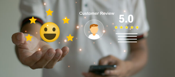 Small business owner holding a five star rating symbol to represent consistent, outstanding customer service that keeps customers coming back.