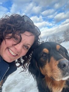 Kari Lotzien, Certified Systems Business Coach®, smiling with her dog