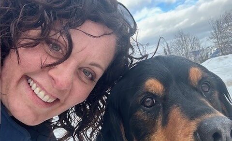 Kari Lotzien, Certified Systems Business Coach®, smiling with her dog